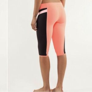 Lululemon Heat It Up Low Rise Cropped Leggings in Pop Orange/Black